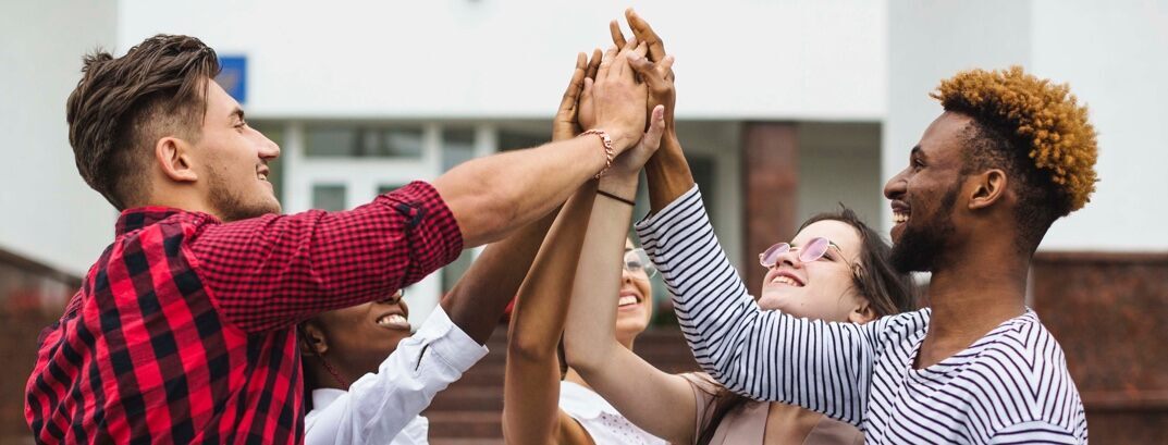 Young advocates putting their hands together